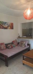 a room with a bed with pillows and a light at Victoria Stay in Jinja