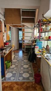 a room with a kitchen with a lot of items at Sky Garden Home in Dhaka