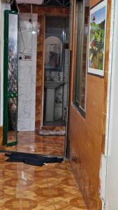 a room with a wooden floor and a door at Sky Garden Home in Dhaka +12 photos