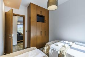 Ένα ή περισσότερα κρεβάτια σε δωμάτιο στο Luxury VILLA RAFAEL +83 φωτογραφίες