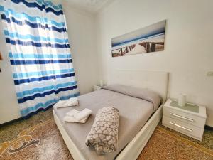 Postel nebo postele na pokoji v ubytování Brignole Home