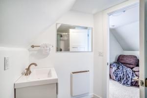 a bathroom with a sink and a mirror at Whales Cove in Waldport +32 photos