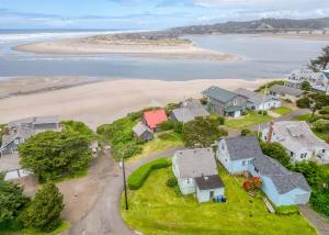 an aerial view of a beach with houses at Whales Cove in Waldport