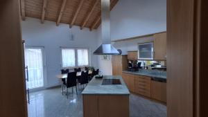 a kitchen with a table and chairs in a room at Aquarell Apartments in Saas-Grund