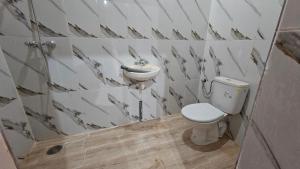 a bathroom with a toilet and a sink at Dar salam in Mhamid