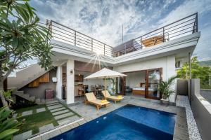 a villa with a swimming pool and a house at Galatia Villa in Bukti