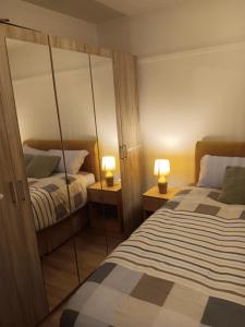 Ένα ή περισσότερα κρεβάτια σε δωμάτιο στο High Class Accommodations 30