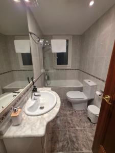 a bathroom with a sink and a toilet at Beach Big Apartment With 3 Rooms Apartment Parking Included in San Sebastián +25 photos