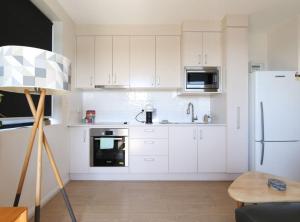 Kuchyň nebo kuchyňský kout v ubytování Gorgeous 2-Bed Apartment By Shops and the River + 9 fotografií