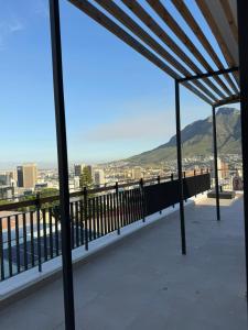 a balcony with a view of a city at Views on August - Penthouse Unit 9 in Cape Town