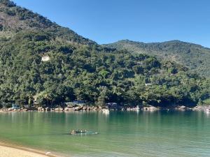 a group of people in a boat in the water at casa da Cilene in Angra dos Reis
