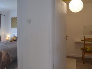 Ένα ή περισσότερα κρεβάτια σε δωμάτιο στο Lambs Cottage