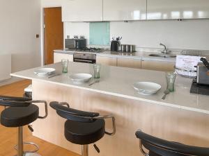 a kitchen with a counter with three bowls on it at 12 Zinc in Newquay
