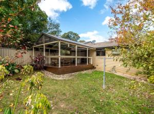 an image of a home with a large screened in porch at Spacious and Restful Holiday Home with Backyard in Weetangerra