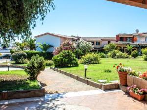 a view of the garden of a house at Apartment with Pool and Private Parking in Porto Ottiolu