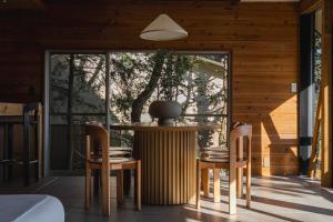 a dining room with a table and two chairs at tomaru wool -moku- in Atami +61 photos