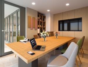 a dining room table with a laptop on top of it at New condo near the sea, Laguna, Choeng Thale 324 in Ban Thalat Choeng Thale