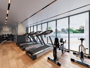 a gym with a row of treadmills and ellipticals at New condo near the sea, Laguna, Choeng Thale 324 in Ban Thalat Choeng Thale