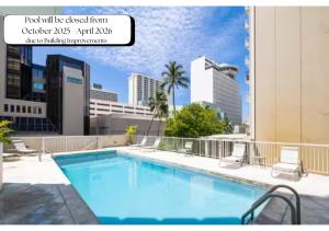 a swimming pool on the roof of a building at Marine Surf 20FL Free Parking Renovated - Cal King in Honolulu
