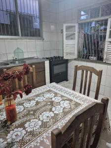a kitchen with a table with a table cloth on it at Home in Belém cop 30 in Belém