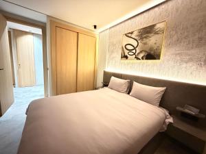 Ένα ή περισσότερα κρεβάτια σε δωμάτιο στο Sweet Stay