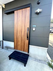a wooden door on the side of a building at Tsubame Zushi Hayama in Zushi +55 photos