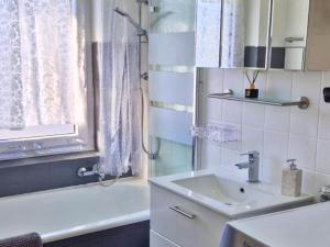 a bathroom with a sink and a shower and a tub at Apartment in Herrischried in Herrischried +32 photos