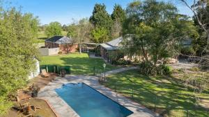 an overhead view of a backyard with a swimming pool at Raygold Park Equestrian Accommodation plus Pool House in Moorooduc