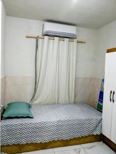 Ένα ή περισσότερα κρεβάτια σε δωμάτιο στο Apartamento Completo e Centralizado 2