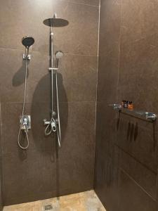 a bathroom with a shower with a shower head at Tukonnee Villas Koh Yao Noi in Ko Yao Noi