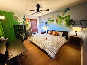 a bedroom with a bed with pumpkins on it at 2 Bedrooms Private Kitchen Livingroom Robinwood Condo Suite in Norcross