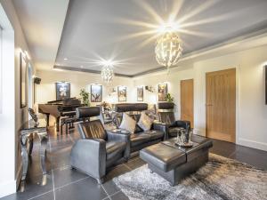a living room with a couch and a table at The Paddocks Retreat in North Thoresby