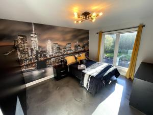 a bedroom with a wall mural of a city at Le SUMMUM in Sainte Anne des Lacs +75 photos