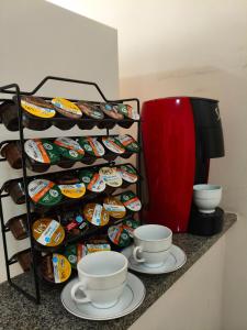 a rack filled with lots of different types of food at Apartamento in Viçosa