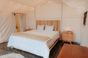 Ένα ή περισσότερα κρεβάτια σε δωμάτιο στο HappyNest Glamping and Villa Dieng