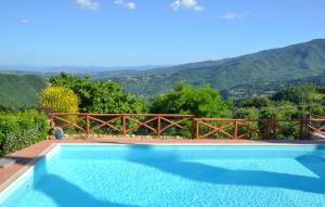 a swimming pool with a view of the mountains at Amazing Apartment In Caprese Michelangelo in Caprese Michelangelo