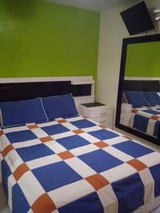 Voodi või voodid majutusasutuse Cozy Modern Apartment, Residencia El Rodeo toas