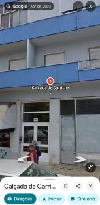 a building with a sign that says calaza de carril at CarriCHe 2 in Lisbon +5 photos