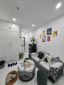 a living room with a couch and a table at Hear Homestay Tây Hồ in Hanoi