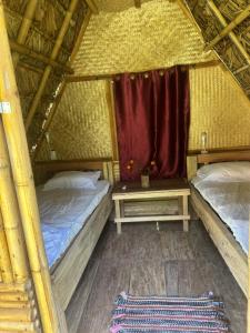 Postel nebo postele na pokoji v ubytování Petros Bungalows