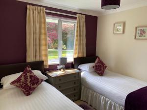 Ένα ή περισσότερα κρεβάτια σε δωμάτιο στο Pencarrow - B6521