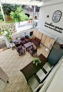 an overhead view of a patio with tables and chairs at Baan Puen Poonsuk in Hua Hin