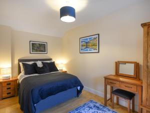 Ένα ή περισσότερα κρεβάτια σε δωμάτιο στο The Old Milking Parlour