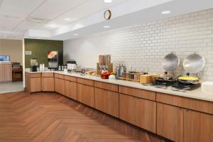 a kitchen with a counter with pots and pans at Fairfield Inn & Suites by Marriott Waco North in Waco