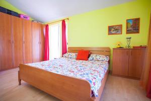 Postel nebo postele na pokoji v ubytování Villa Dario