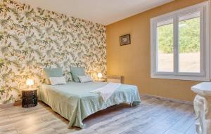 Ένα ή περισσότερα κρεβάτια σε δωμάτιο στο Charmante Maison À La Campagne