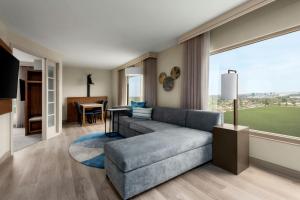 a living room with a couch and a table at Anaheim Marriott Suites in Anaheim