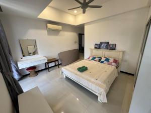 a bedroom with a bed and a mirror at Spacious 3BR Homestay - Trinity Residence Kuching City in Kuching +87 photos