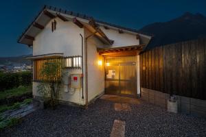 a small house with a door and a fence at Yufu no Yu Raku - Vacation STAY 18768v in Yufuin