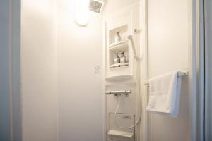 a small bathroom with a shower and a sink at 晴宿-Hareyado  +47 photos